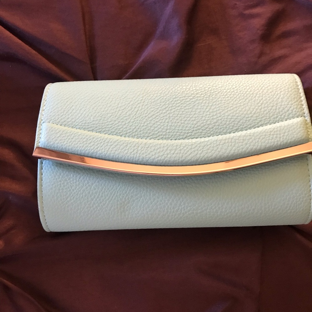 Boutique Teal green clutch bag brand ended up not using